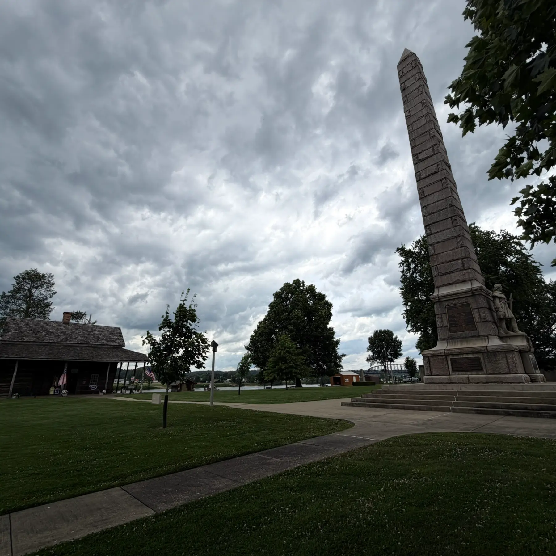 Stone obelisk beneath storm clouds in Point Pleasant